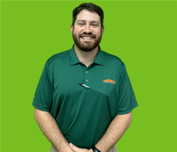 SERVPRO employee on green background